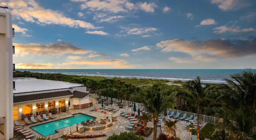 Coastal view of motels in Cocoa Beach, Florida with nearby beach access.