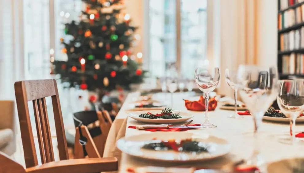 Friends and family enjoying a high-energy holiday party with structured activities and winter decorations